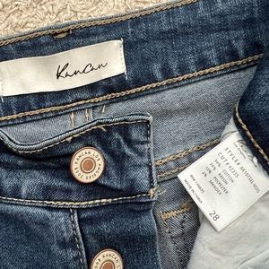 Size 28, Kan Can capris with button front.